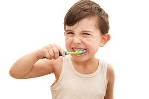 Young Boy Brushing Teeth