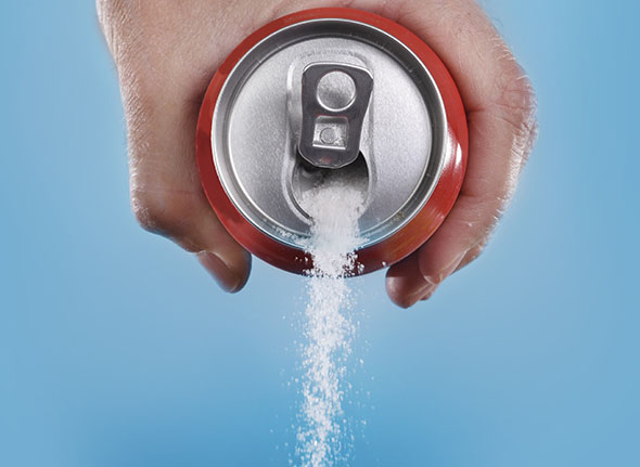 hand holding can pouring soda | Kenneth J. Wolnik, DDS