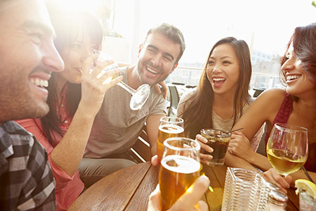 group of friends enjoying drinks | Doctor Kenneth Wolnik
